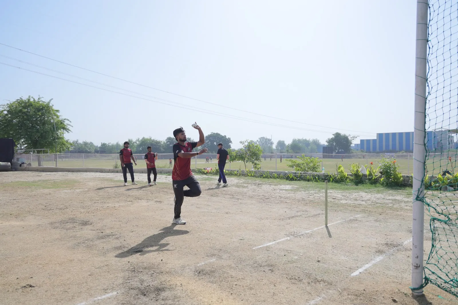 Bowler in his delivery stride during GPL practice at HLM ground
